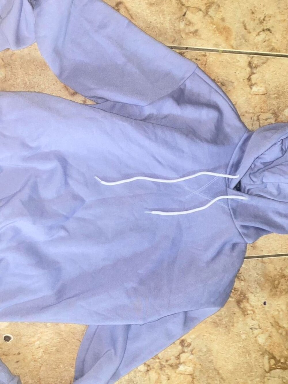 Lavender hoodie with white drawstrings